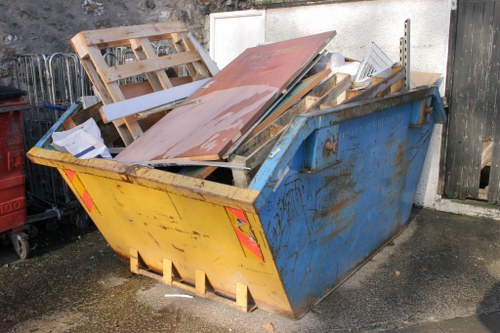 Demolition site with construction debris in Palmers Green