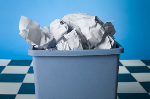 Professional cleaners sorting items during house clearance